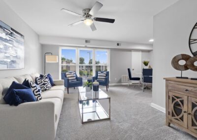 An elegant living room with a significant clock displayed on the wall, contributing to the overall aesthetic of the area